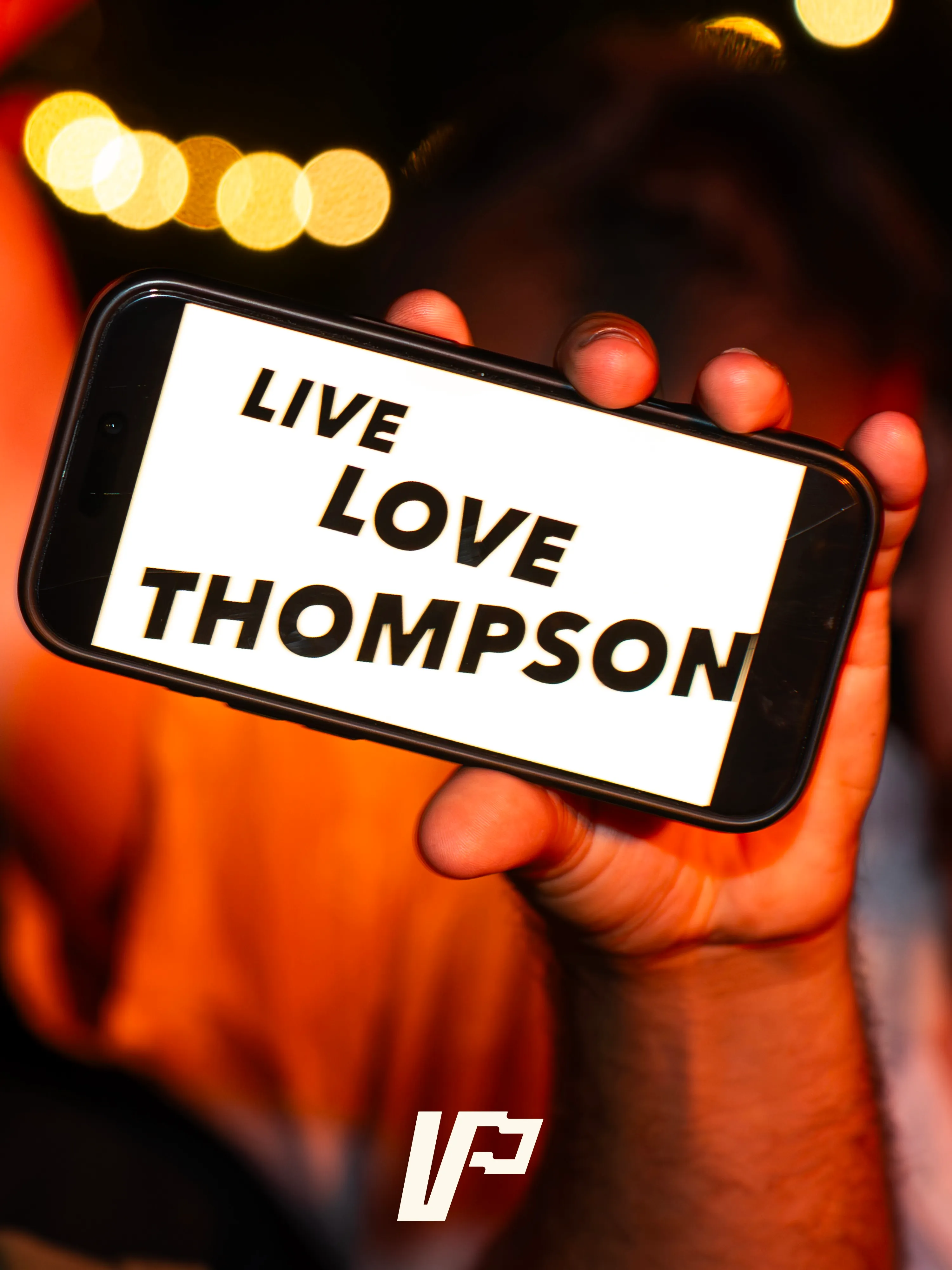 "Live Love Thompson", held up in the crowd